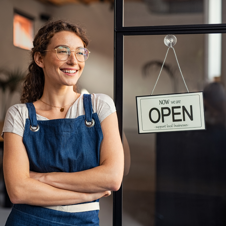 Small business owner working with customers